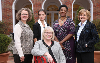 Teachers in front of a building